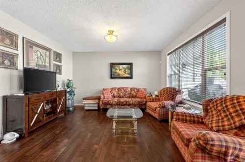 27 Panatella Row Nw, Calgary, AB - Indoor Photo Showing Living Room