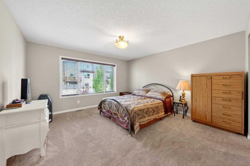 27 Panatella Row Nw, Calgary, AB - Indoor Photo Showing Bedroom