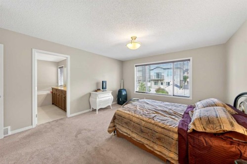 27 Panatella Row Nw, Calgary, AB - Indoor Photo Showing Bedroom