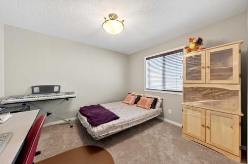 27 Panatella Row Nw, Calgary, AB - Indoor Photo Showing Bedroom