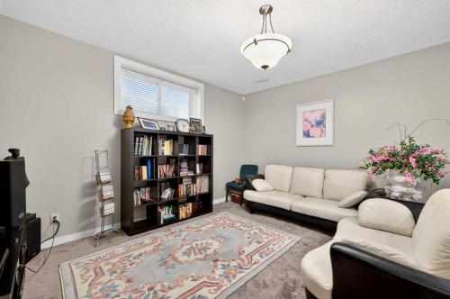 27 Panatella Row Nw, Calgary, AB - Indoor Photo Showing Living Room
