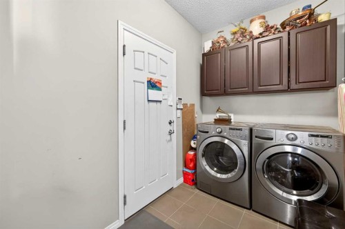 27 Panatella Row Nw, Calgary, AB - Indoor Photo Showing Laundry Room