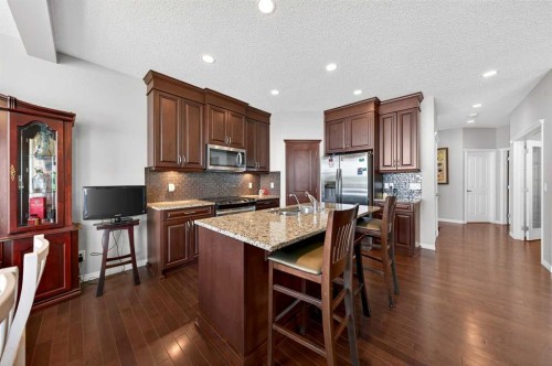 27 Panatella Row Nw, Calgary, AB - Indoor Photo Showing Kitchen With Stainless Steel Kitchen With Double Sink With Upgraded Kitchen