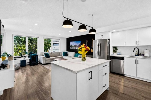 103-1920 11 Avenue Sw, Calgary, AB - Indoor Photo Showing Kitchen With Stainless Steel Kitchen With Upgraded Kitchen