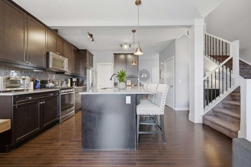 406 River Heights Crescent, Cochrane, AB - Indoor Photo Showing Kitchen With Upgraded Kitchen