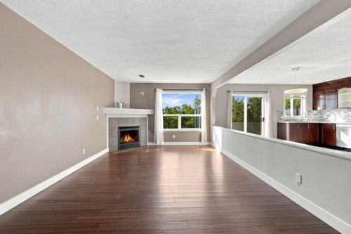 541 Citadel Meadow Bay Nw, Calgary, AB - Indoor Photo Showing Living Room With Fireplace