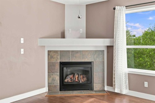 541 Citadel Meadow Bay Nw, Calgary, AB - Indoor Photo Showing Living Room With Fireplace