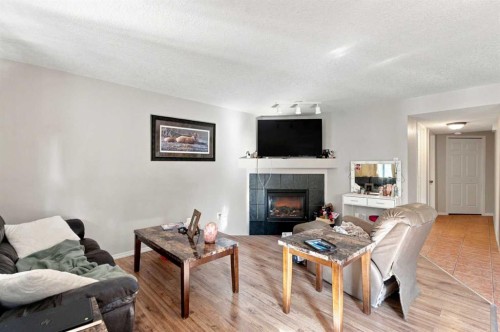 541 Citadel Meadow Bay Nw, Calgary, AB - Indoor Photo Showing Living Room With Fireplace