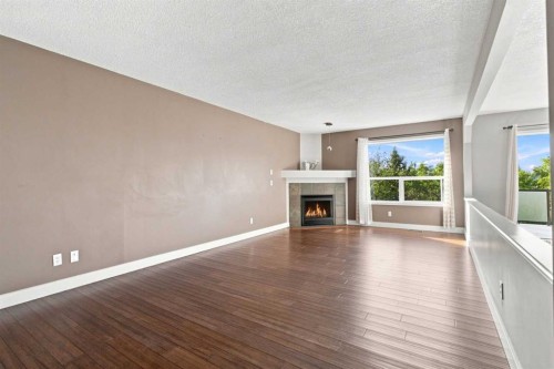 541 Citadel Meadow Bay Nw, Calgary, AB - Indoor Photo Showing Living Room With Fireplace
