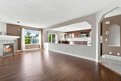 541 Citadel Meadow Bay Nw, Calgary, AB - Indoor Photo Showing Living Room With Fireplace