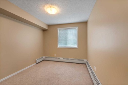 1213-4 Kingsland Close Se, Airdrie, AB - Indoor Photo Showing Other Room