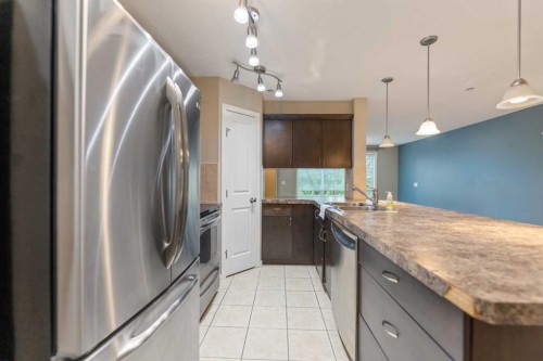 1213-4 Kingsland Close Se, Airdrie, AB - Indoor Photo Showing Kitchen With Upgraded Kitchen