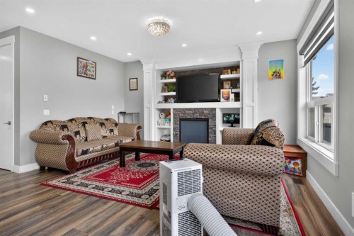 120 Castlegrove Road Ne, Calgary, AB - Indoor Photo Showing Living Room With Fireplace