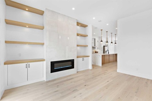 907 36A Street Nw, Calgary, AB - Indoor With Fireplace
