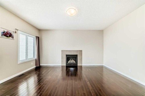 12 Kincora Mews Nw, Calgary, AB - Indoor Photo Showing Other Room With Fireplace