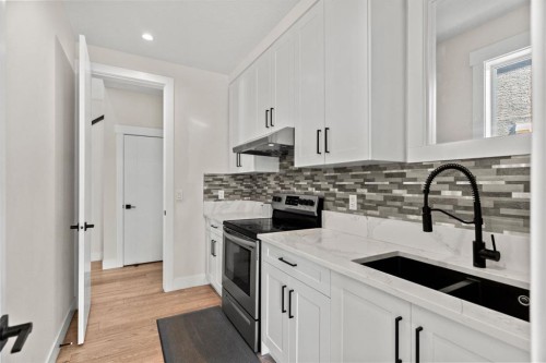 129 Marina Key, Chestermere, AB - Indoor Photo Showing Kitchen With Double Sink With Upgraded Kitchen