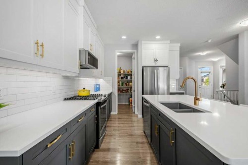 114 Crestbrook Way Sw, Calgary, AB - Indoor Photo Showing Kitchen With Double Sink With Upgraded Kitchen