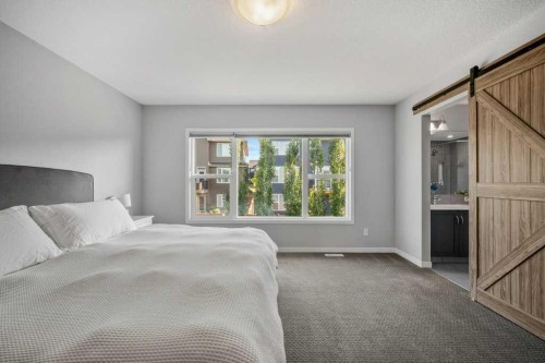 114 Crestbrook Way Sw, Calgary, AB - Indoor Photo Showing Bedroom