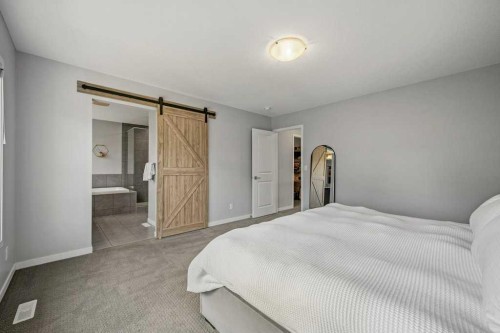 114 Crestbrook Way Sw, Calgary, AB - Indoor Photo Showing Bedroom