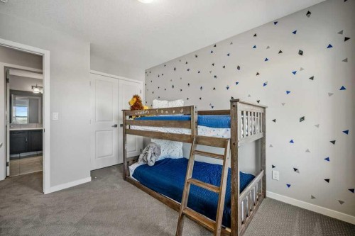 114 Crestbrook Way Sw, Calgary, AB - Indoor Photo Showing Bedroom