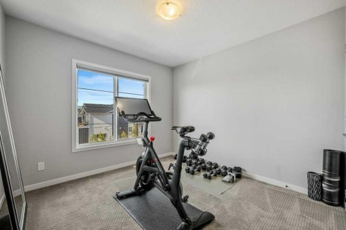 114 Crestbrook Way Sw, Calgary, AB - Indoor Photo Showing Gym Room