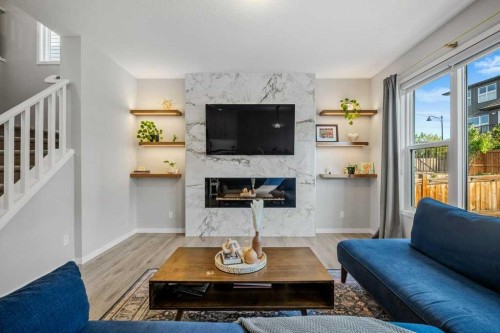 114 Crestbrook Way Sw, Calgary, AB - Indoor Photo Showing Living Room With Fireplace