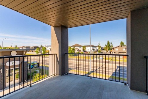 7202-403 Mackenzie Way Sw, Airdrie, AB - Outdoor With Balcony With Exterior