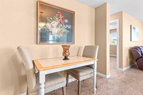 7202-403 Mackenzie Way Sw, Airdrie, AB - Indoor Photo Showing Dining Room
