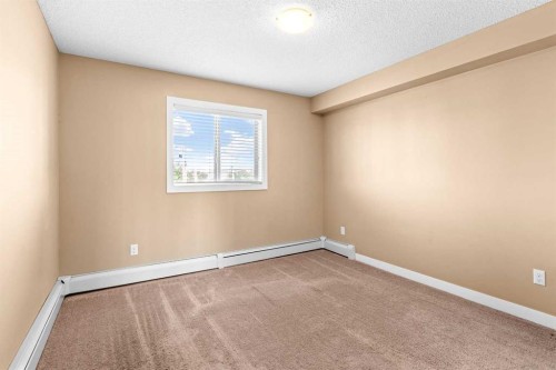 7202-403 Mackenzie Way Sw, Airdrie, AB - Indoor Photo Showing Other Room