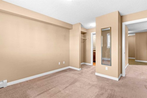 7202-403 Mackenzie Way Sw, Airdrie, AB - Indoor Photo Showing Other Room