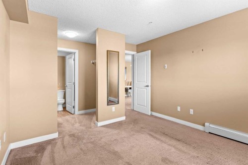 7202-403 Mackenzie Way Sw, Airdrie, AB - Indoor Photo Showing Other Room