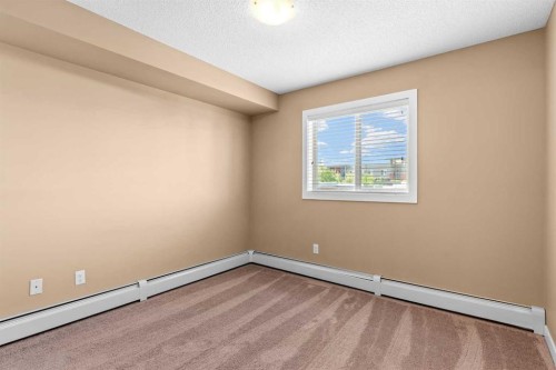 7202-403 Mackenzie Way Sw, Airdrie, AB - Indoor Photo Showing Other Room