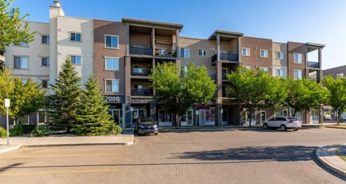 7202-403 Mackenzie Way Sw, Airdrie, AB - Outdoor With Balcony With Facade