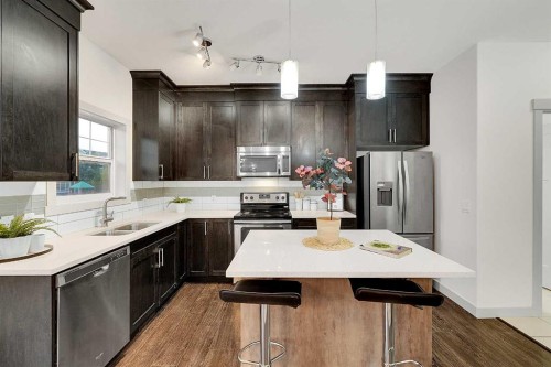 570 Evanston Manor Nw, Calgary, AB - Indoor Photo Showing Kitchen With Stainless Steel Kitchen With Double Sink With Upgraded Kitchen