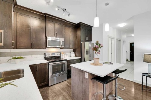 570 Evanston Manor Nw, Calgary, AB - Indoor Photo Showing Kitchen With Stainless Steel Kitchen With Double Sink With Upgraded Kitchen