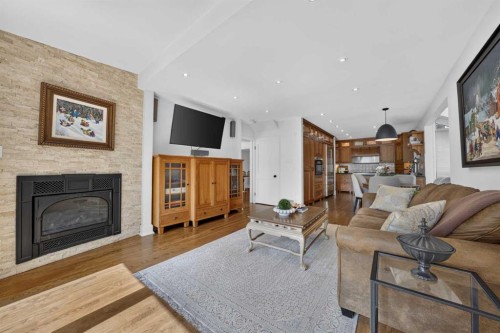 922 Rideau Road Sw, Calgary, AB - Indoor Photo Showing Living Room With Fireplace
