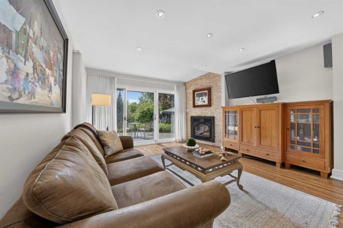 922 Rideau Road Sw, Calgary, AB - Indoor Photo Showing Living Room With Fireplace