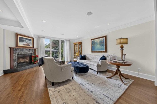 922 Rideau Road Sw, Calgary, AB - Indoor Photo Showing Living Room With Fireplace