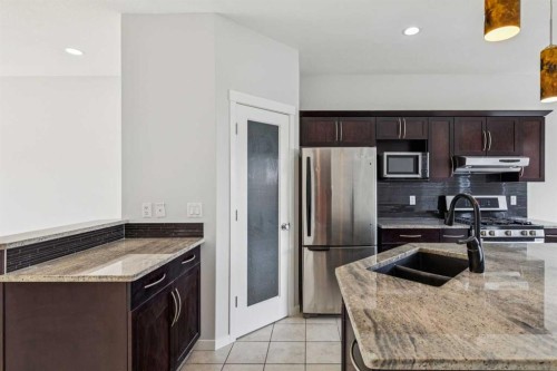 12 Autumn Court Se, Calgary, AB - Indoor Photo Showing Kitchen With Double Sink With Upgraded Kitchen