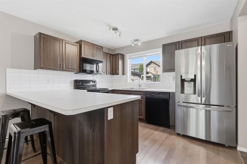 4008 New Brighton Grove Se, Calgary, AB - Indoor Photo Showing Kitchen With Upgraded Kitchen
