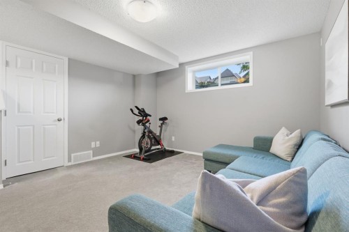 4008 New Brighton Grove Se, Calgary, AB - Indoor Photo Showing Gym Room