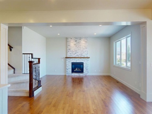 54 Royal Ridge Mount Nw, Calgary, AB - Indoor Photo Showing Living Room With Fireplace