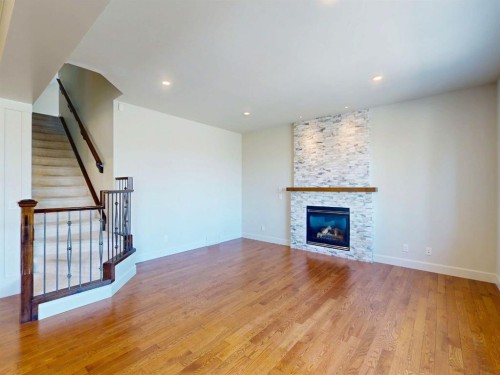 54 Royal Ridge Mount Nw, Calgary, AB - Indoor Photo Showing Living Room With Fireplace