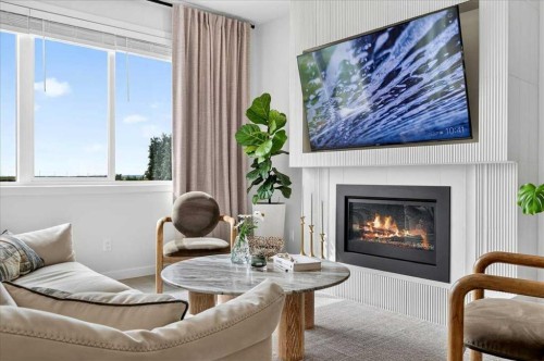 90 Savoy Landing Se, Calgary, AB - Indoor Photo Showing Living Room With Fireplace