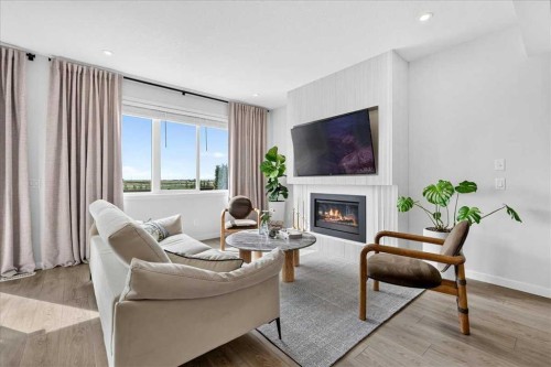90 Savoy Landing Se, Calgary, AB - Indoor Photo Showing Living Room With Fireplace