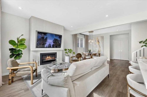90 Savoy Landing Se, Calgary, AB - Indoor Photo Showing Living Room With Fireplace