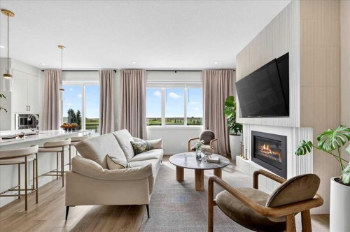 90 Savoy Landing Se, Calgary, AB - Indoor Photo Showing Living Room With Fireplace
