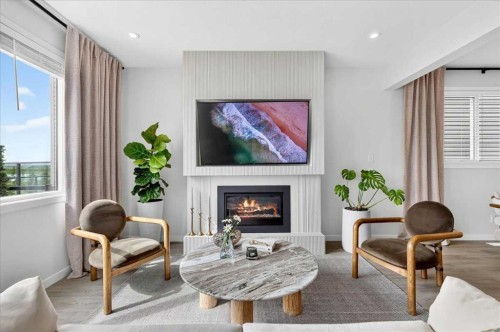 90 Savoy Landing Se, Calgary, AB - Indoor Photo Showing Living Room With Fireplace