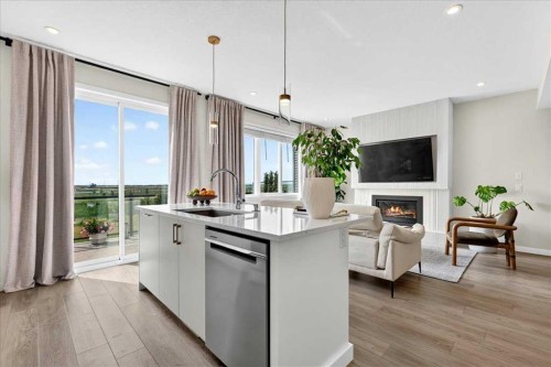 90 Savoy Landing Se, Calgary, AB - Indoor Photo Showing Kitchen With Fireplace With Upgraded Kitchen