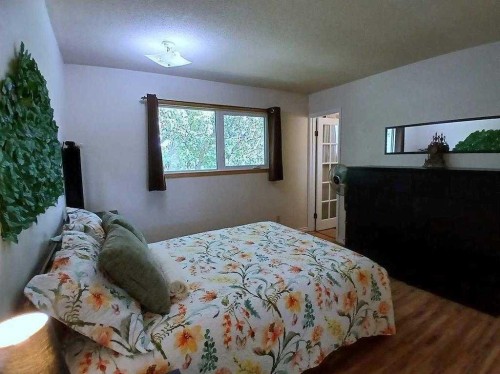 3808 49A Avenue, Innisfail, AB - Indoor Photo Showing Bedroom